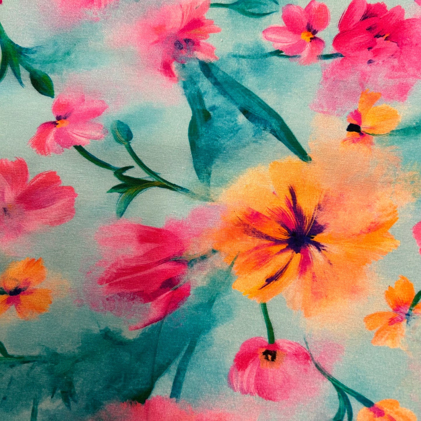 Blomster på blålig baggrund - Bomuldsjersey