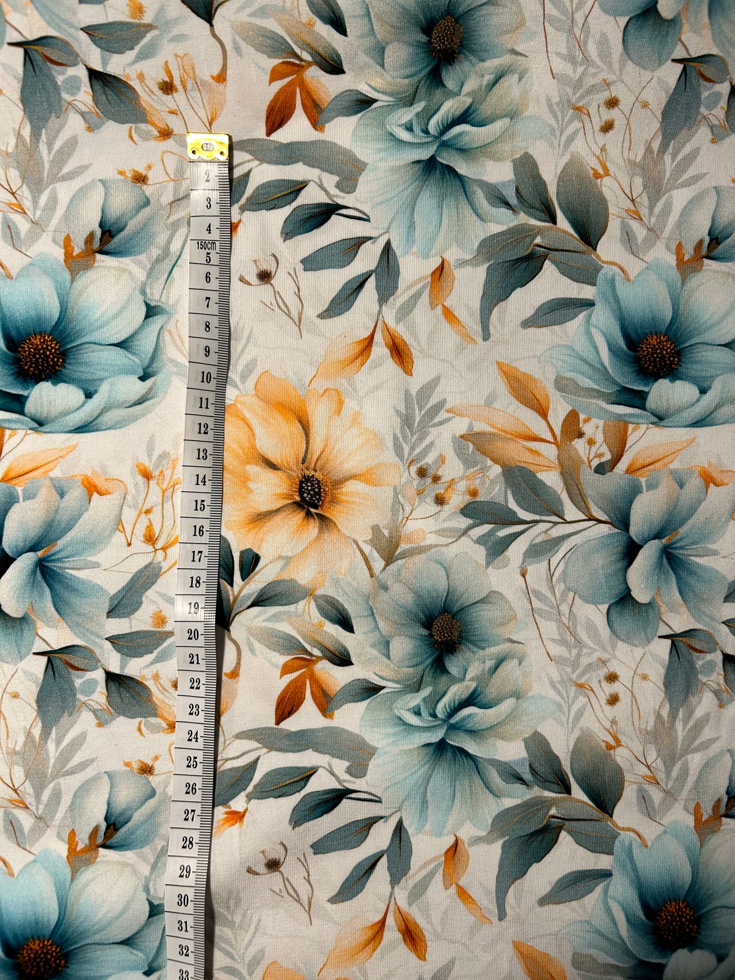 Blå og beige blomster - Bomuldsjersey
