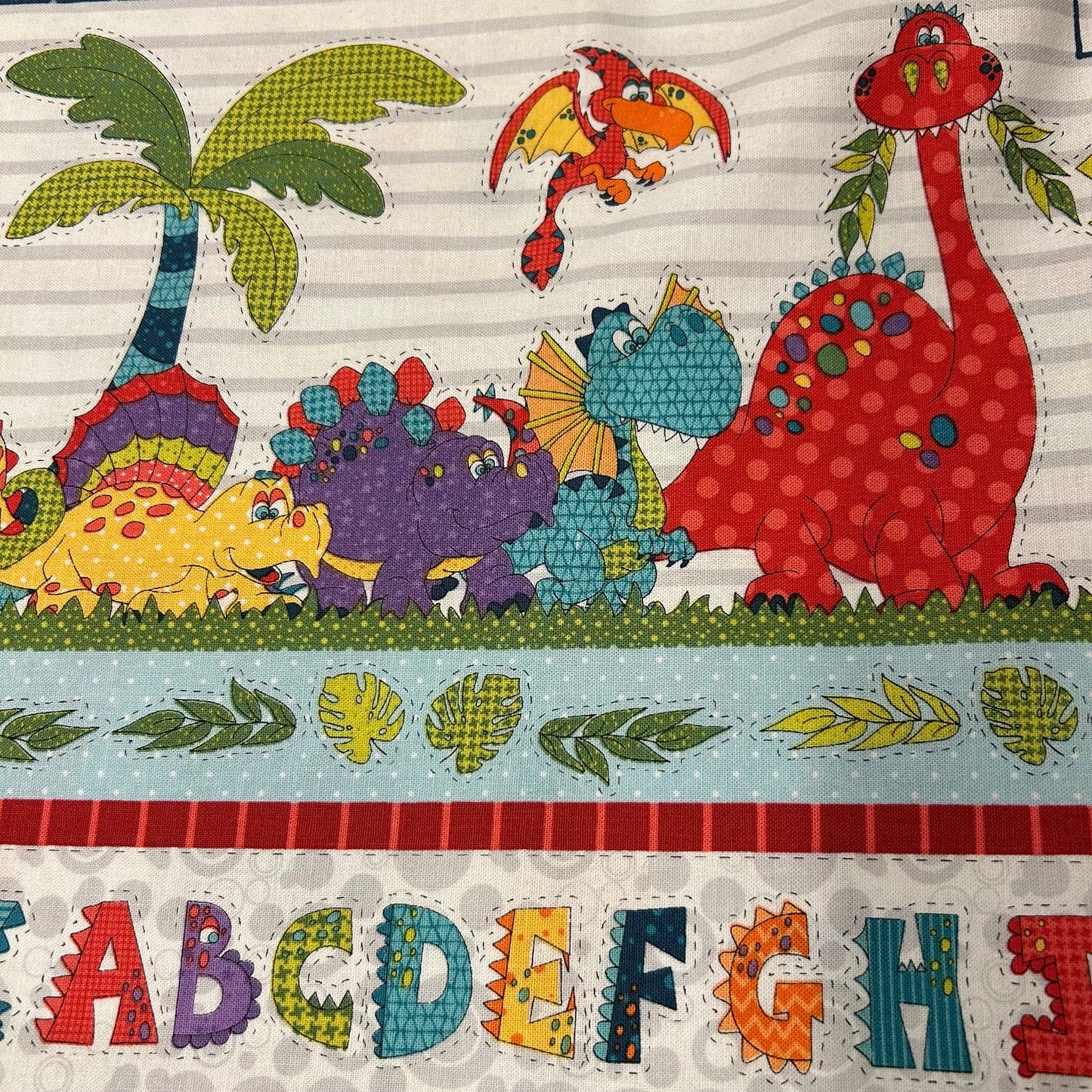 Dino print med mange farver - 100% bomuld